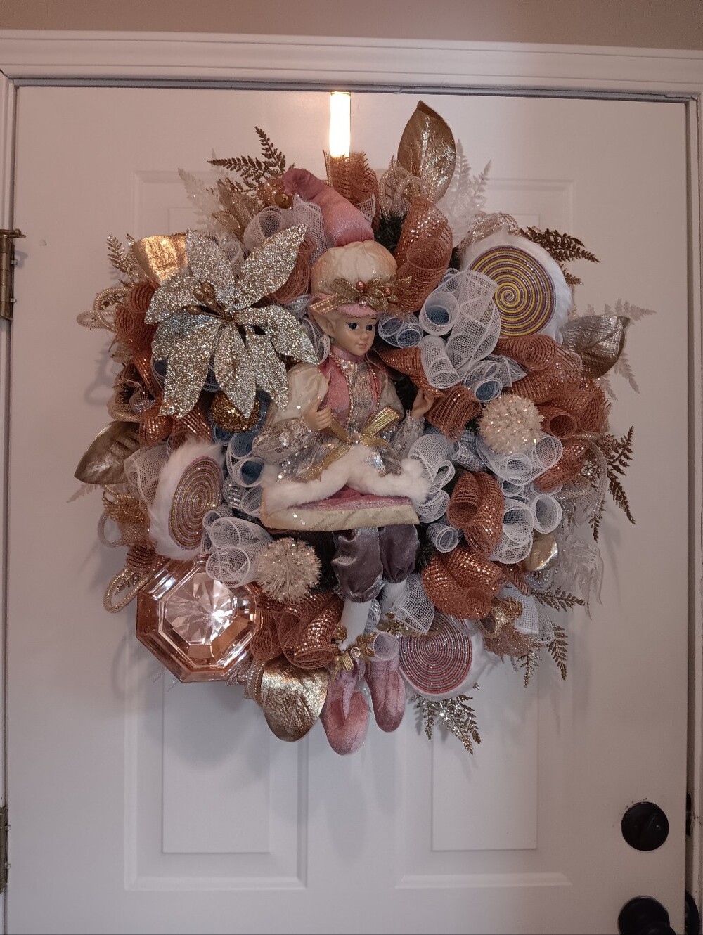 Pink and Rose Gold Holiday Wreath with Large Elf Figurine In The Center
